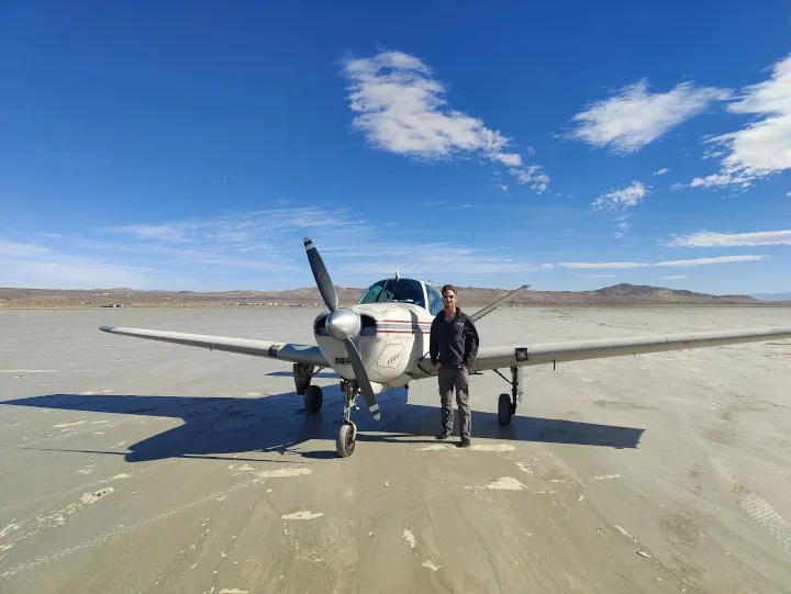 Professional pilot landing on a dry lake bed near Redlands, CA