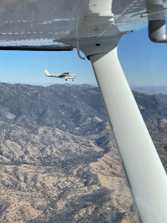 Aircraft flying over the San Bernardino Mountains during mountain training